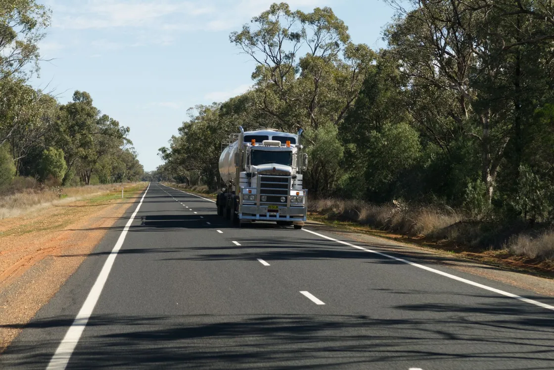 A large goods vehicle travelling along a rural highway