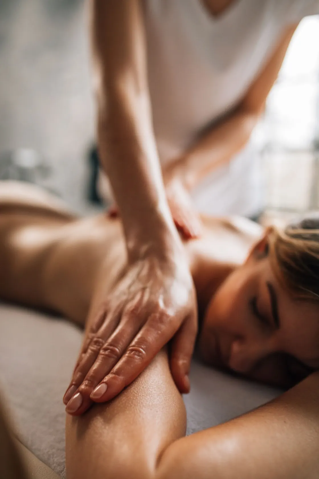 A back massage in a treatment setting