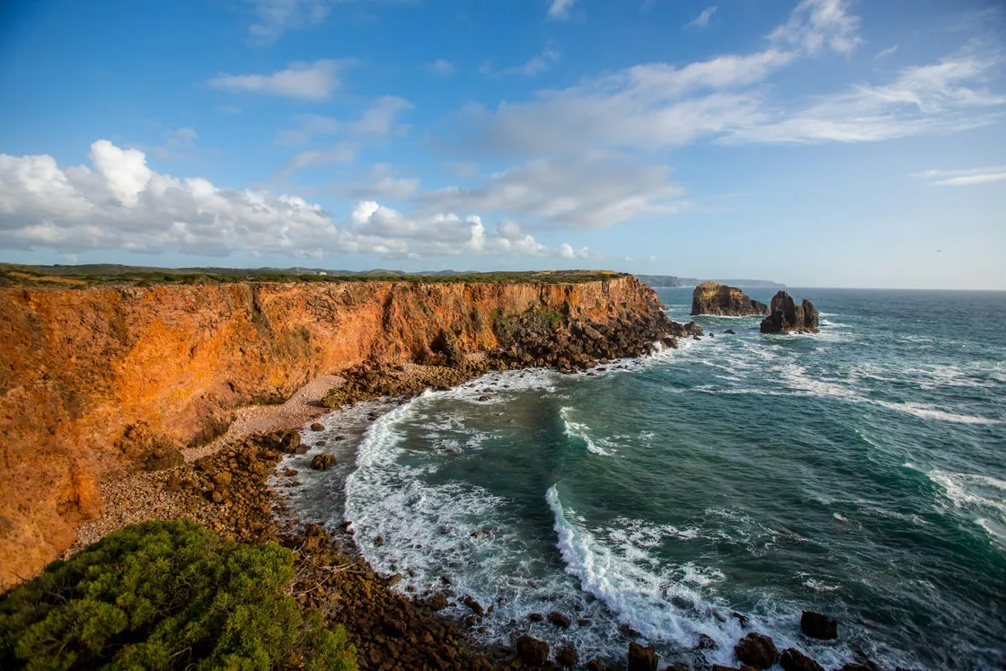 Orange Algarve cliffs above the blue Atlantic Ocean