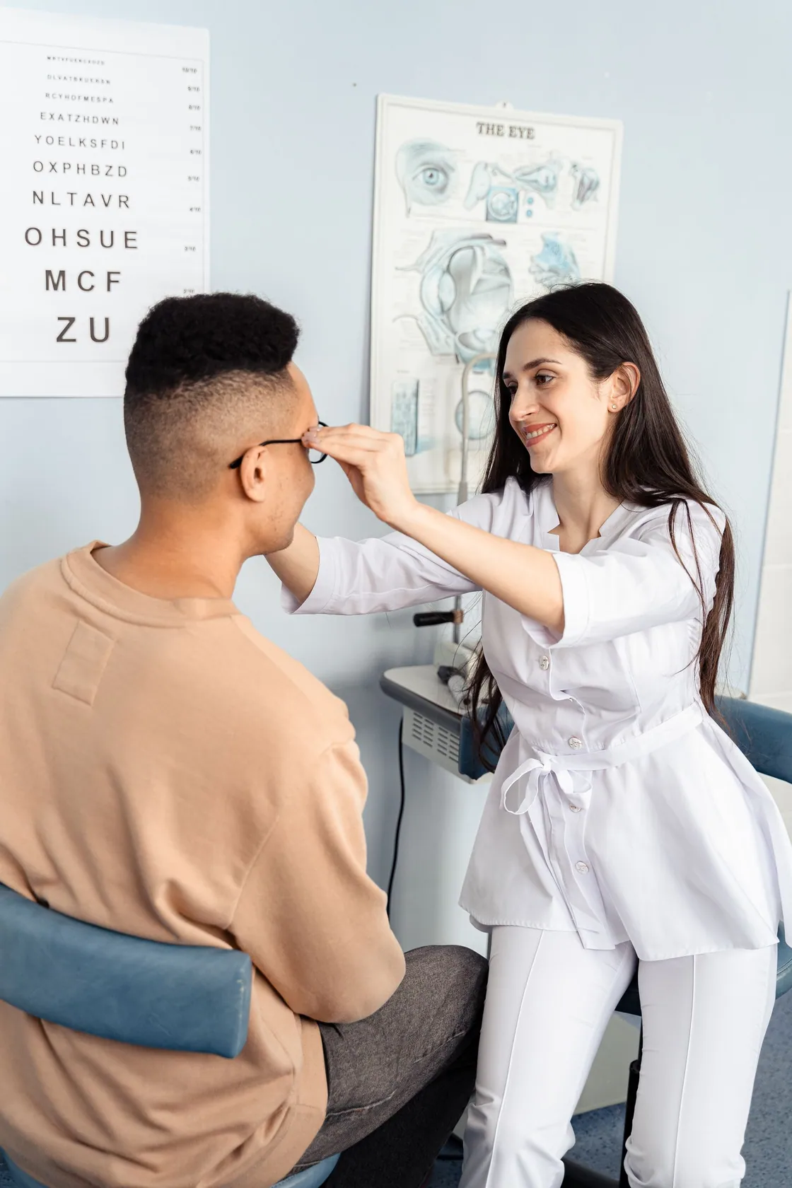 A man and an optical practitioner during an illustrative examination appointment